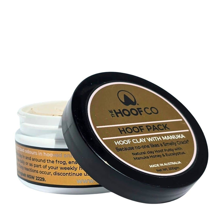 Hoof Pack clay applied to horse hoof frog and sole crevices